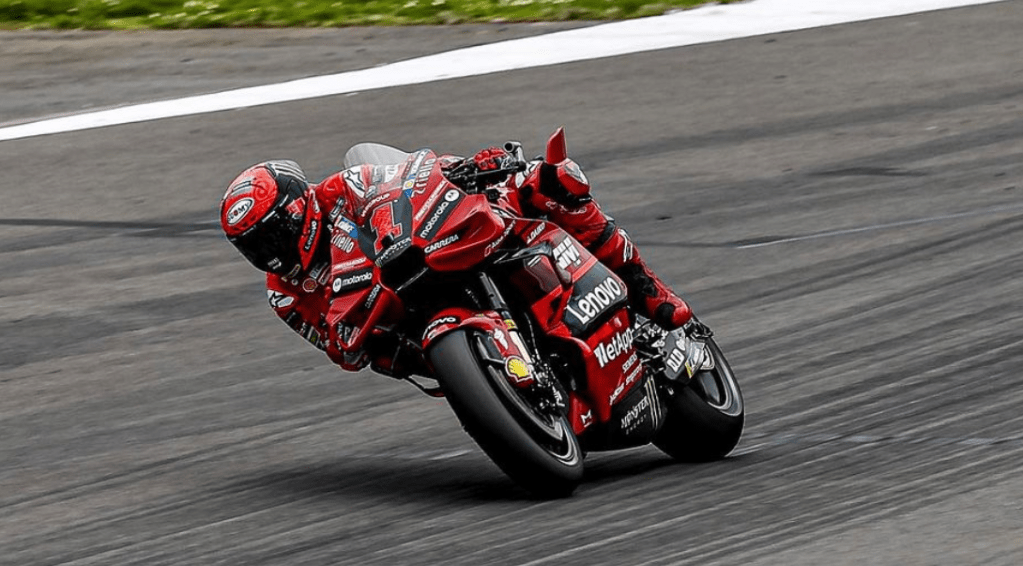 You can’t miss Pecco on his red bike with a large number 1 on the front. He wears red leathers, with the slogan GoFree on the back.