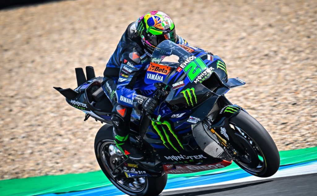 Franky’s Yamaha bike is blue and black with the green Monster logo decorating the sides. His helmet looks green from a distance, but actually has plants and flowers on. The green theme continues on with his number 21 on the front fairing, and on his boots.